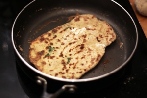 Lovely brown bubbles! This recipe makes real air pockets in the finished naan, delicious.